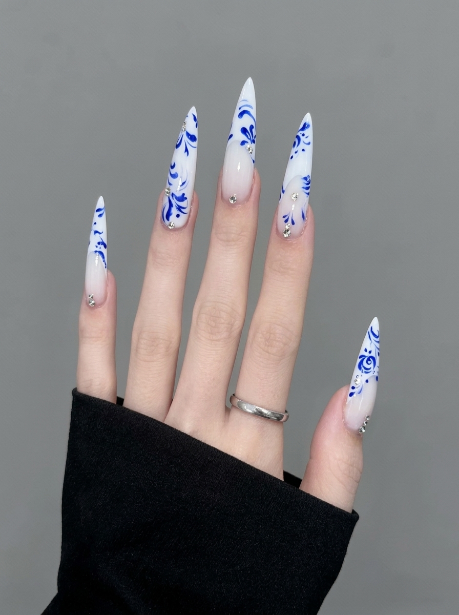 Blue Porcelain Stiletto Nails 💙 | An Elegant Floral Manicure You Can Create at Home nail art design from another angle